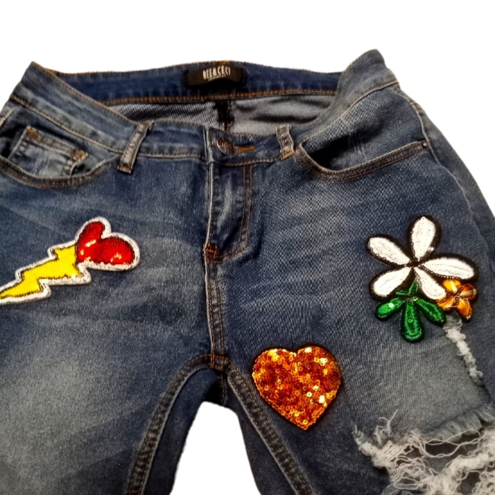 Blue patched stretch cut up jeans
